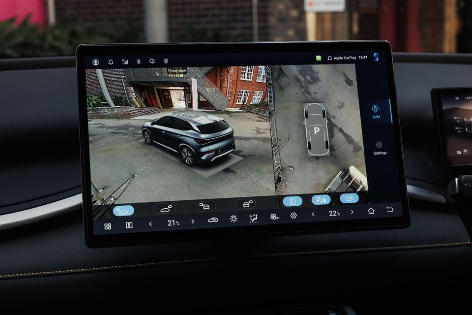 The infotainment screen of a 2027 BYD Atto 3 Evo shows a 360-degree camera view with an around-view monitor display and Apple CarPlay active.