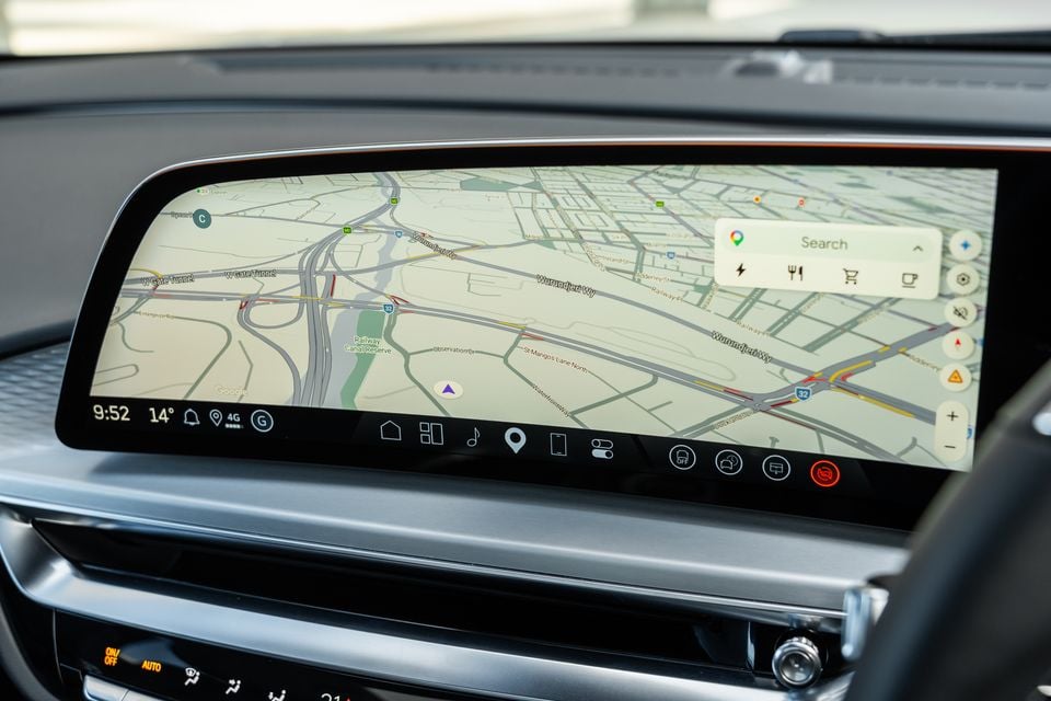 A large touchscreen infotainment display in a 2027 Cadillac Lyriq showing Google Maps navigation with a Melbourne street map