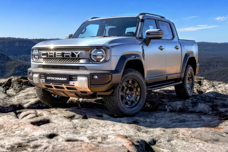 A silver Chery Stockman pickup truck parked on rocky terrain, viewed from the front corner.