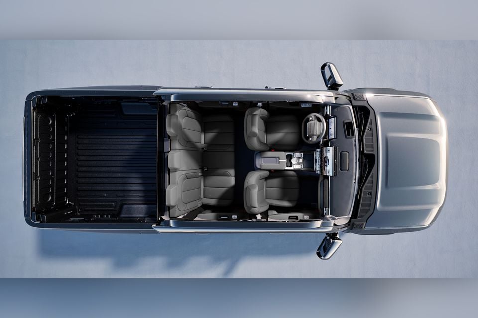 Overhead view of a Chery Stockman ute showing the cabin interior with grey seats and steering wheel alongside the open tray bed