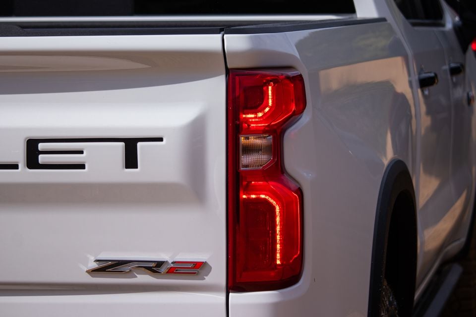 Close-up of the rear tail light and ZR2 badge on a white Chevrolet Silverado ZR2 ute