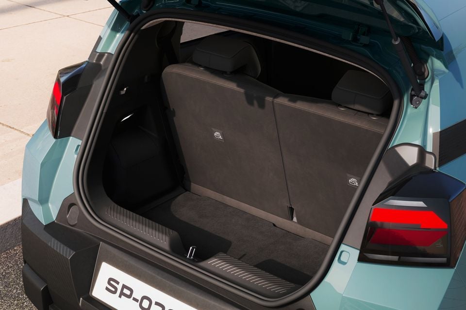 Boot of a Dacia Spring small SUV open, showing the cargo area and rear seat backs