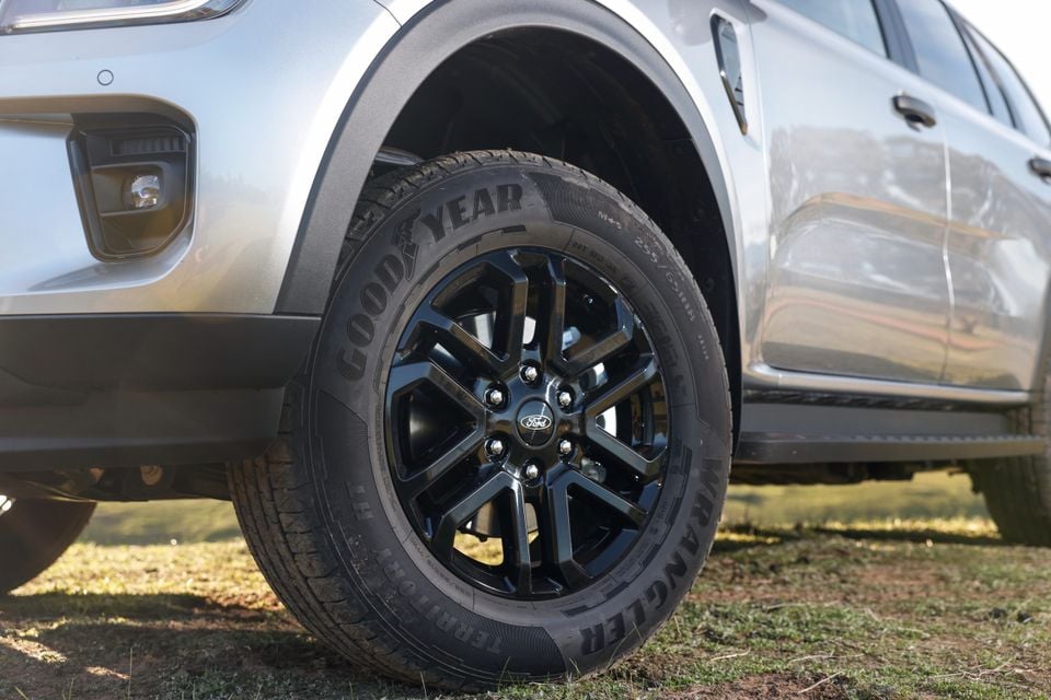 Close-up of a black alloy wheel with Goodyear Wrangler tyre on a silver Ford Everest Active SUV