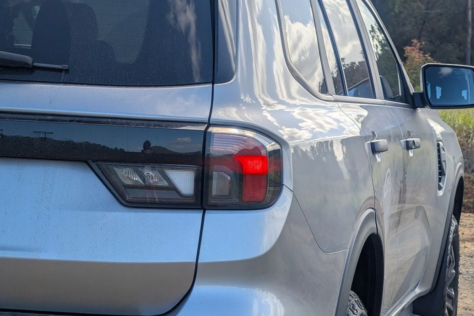 Close-up of the rear tail light on a silver Ford Everest SUV, seen from the rear side