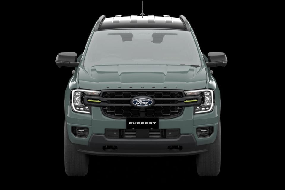 A green 2027 Ford Everest Wolftrak SUV shown head-on against a black background
