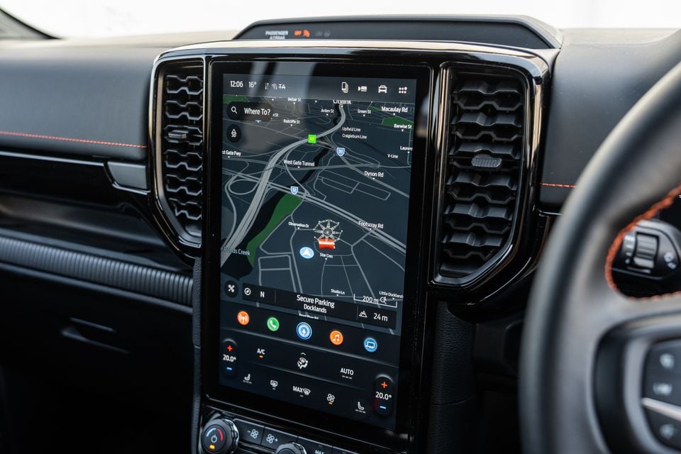 The large touchscreen infotainment display in a Ford Ranger Wildtrak showing a Waze navigation map of Melbourne's Docklands area