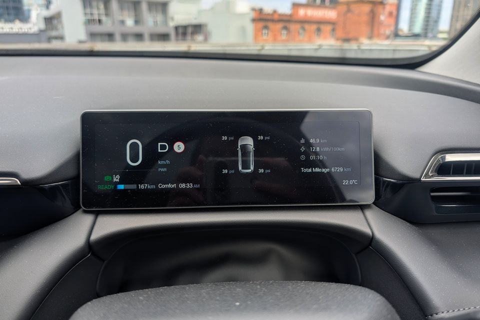 The digital instrument cluster of a GAC Aion V electric vehicle showing speed, drive mode, tyre pressure readings, remaining range of 167km, and total mileage of 6729km