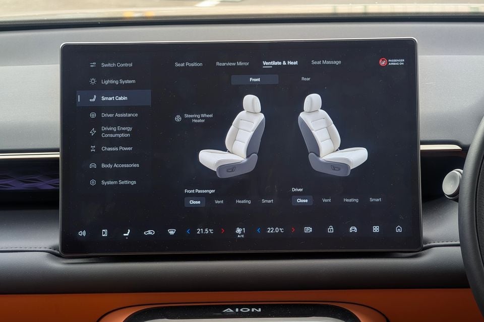 The touchscreen infotainment display in a GAC Aion V showing the Smart Cabin seat ventilation and heating controls menu