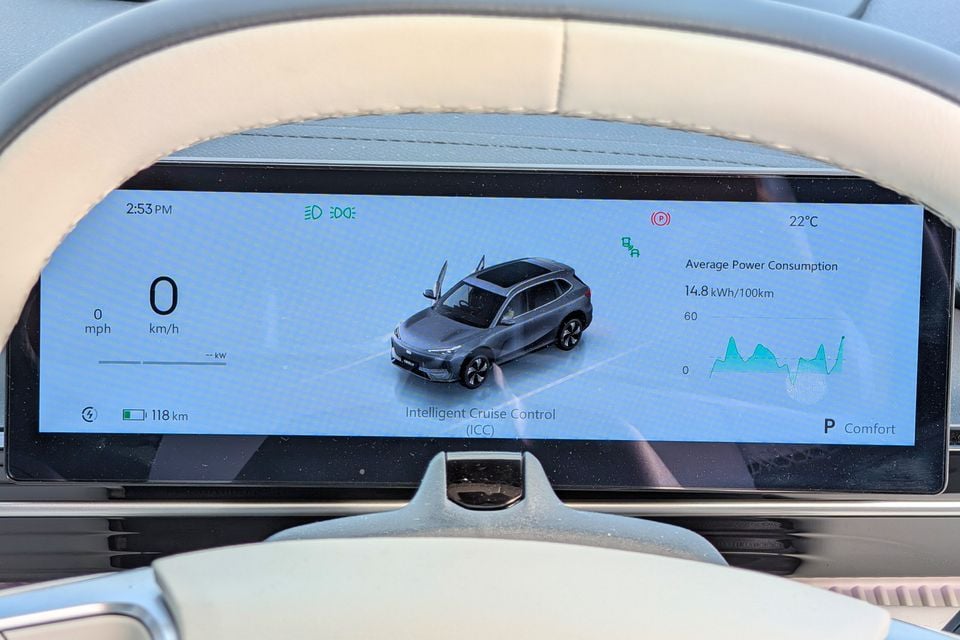 The digital instrument cluster of a Geely GX5 Inspire showing speed, 118km remaining range, average power consumption of 14.8 kWh/100km, and Intelligent Cruise Control (ICC) in Comfort mode