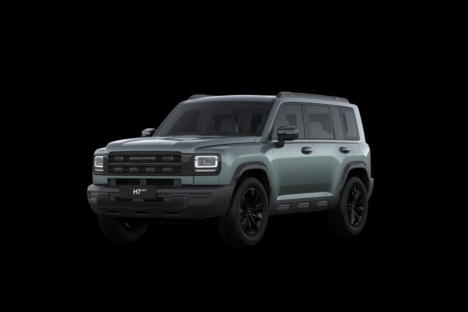 A grey-green 2027 GWM Haval H7 HEV SUV seen from the front left against a black background
