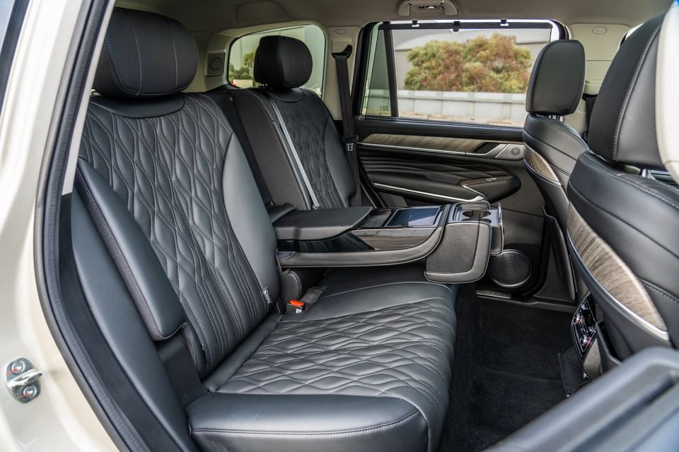 Quilted black leather rear seats of a GWM Tank 500 Ultra PHEV, showing the centre armrest with cupholders and rear controls