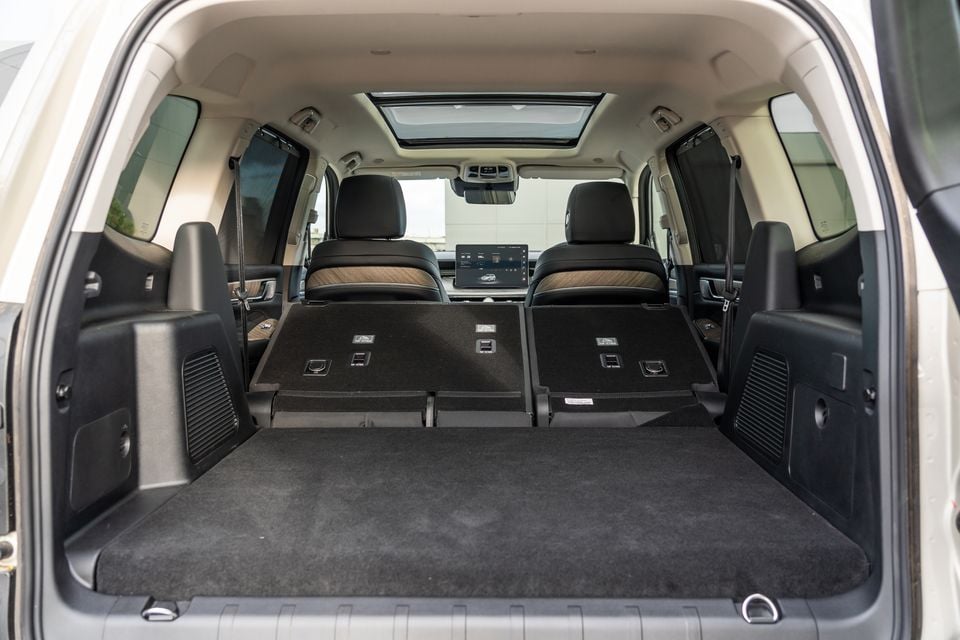 Interior boot area of a GWM Tank 500 Ultra PHEV SUV with the third-row seats folded flat, showing a large, open cargo space viewed from the rear