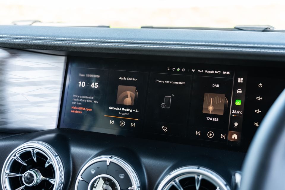 The infotainment touchscreen of a GWM Tank 300 Ultra PHEV showing Apple CarPlay, DAB radio, and voice assistant widgets on the centre console display