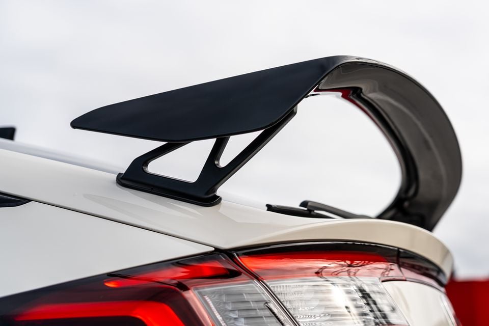 Close-up of the rear spoiler and tail light on a white 2027 Honda Civic Type R