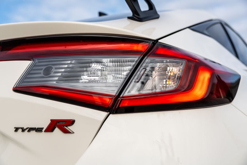 Close-up of the rear tail light and Type R badge on a white Honda Civic Type R hatchback