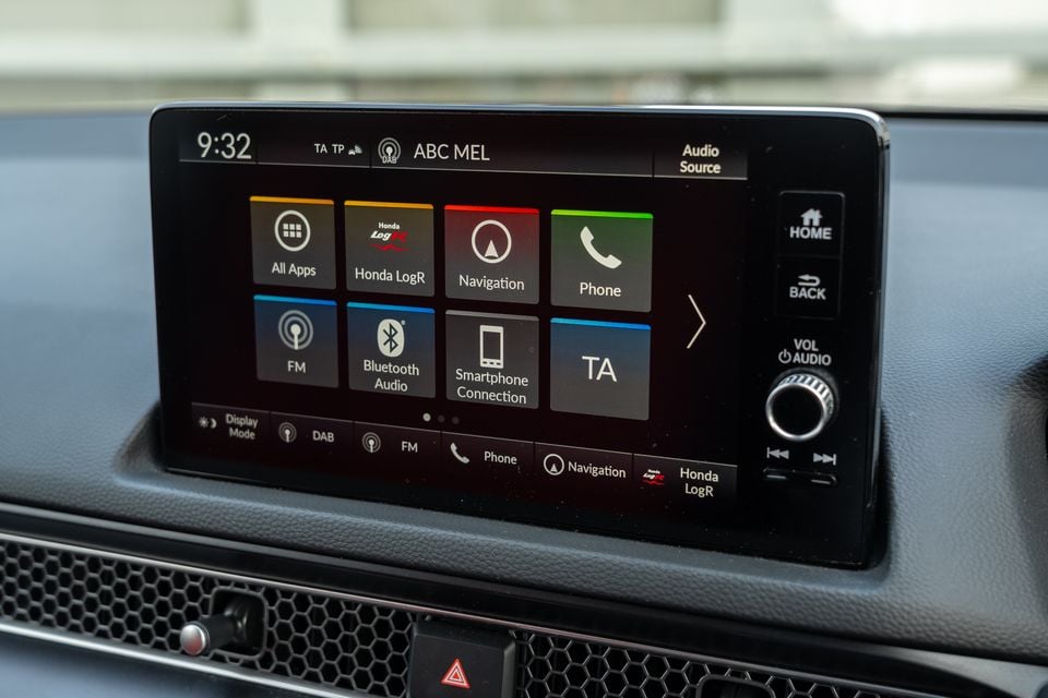 Honda touchscreen infotainment system in a Honda Civic Type R, showing the home screen with navigation, phone, Bluetooth, and smartphone connection options, tuned to ABC Melbourne on DAB radio
