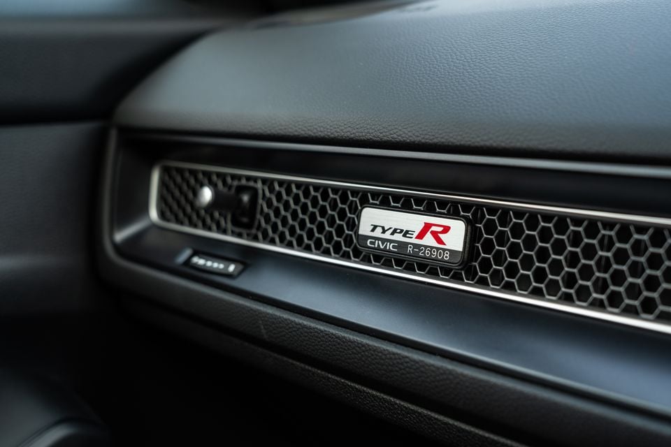 Honda Civic Type R numbered build plaque on the dashboard vent trim, reading 'Type R Civic R-26908'