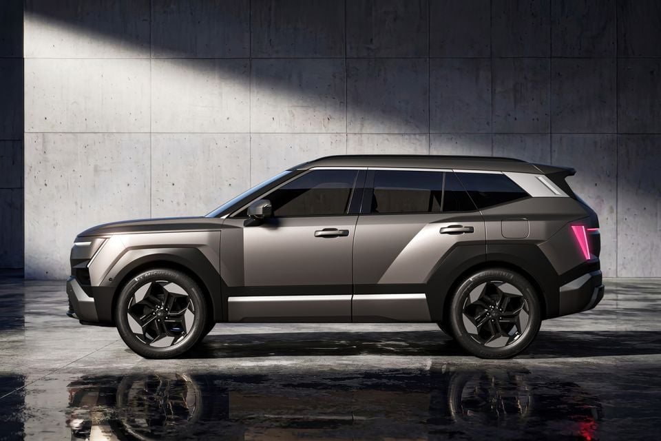 A grey 2027 Hyundai Tucson SUV photographed from the side in a studio setting.