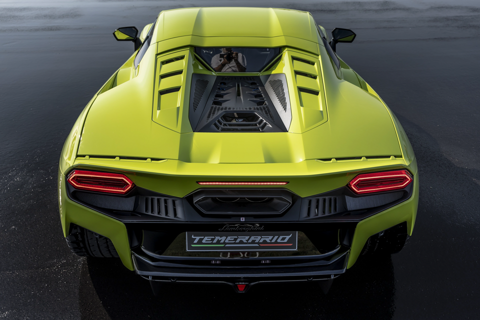 A lime green Lamborghini Temerario sports car viewed from above and behind, showing its engine vents and rear taillights.