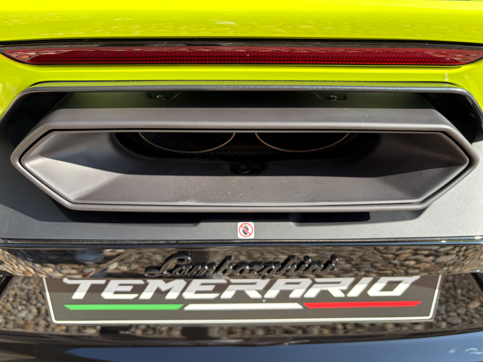 Close-up of the rear diffuser, exhaust tips and Temerario badge on a yellow Lamborghini Temerario