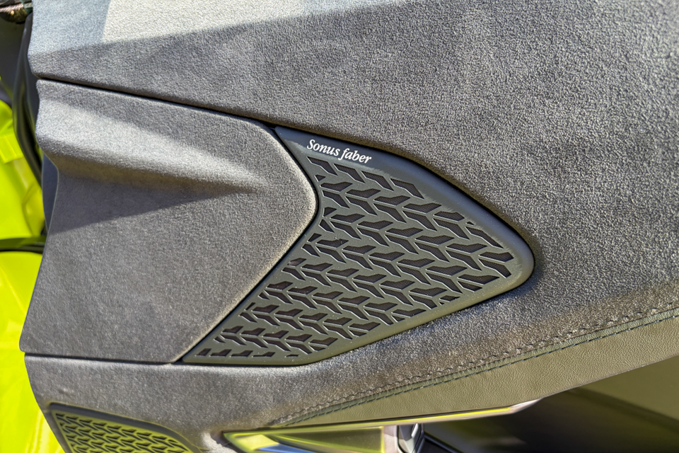 A close-up of a Sonus Faber speaker grille on the door trim inside a Lamborghini Temerario