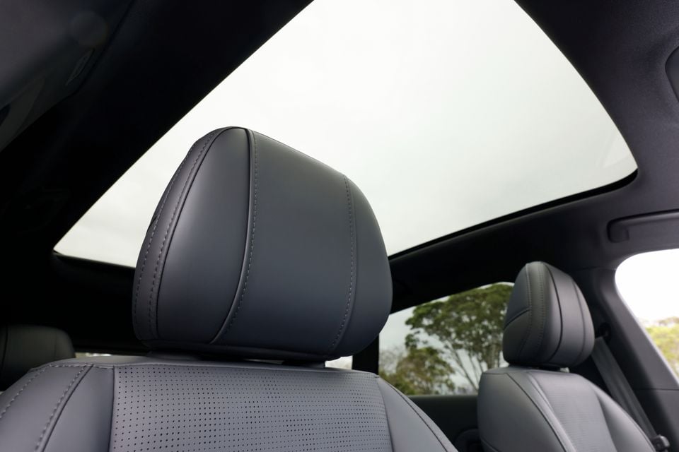 Grey leather front seats beneath a large panoramic glass roof inside the 2027 Leapmotor B05