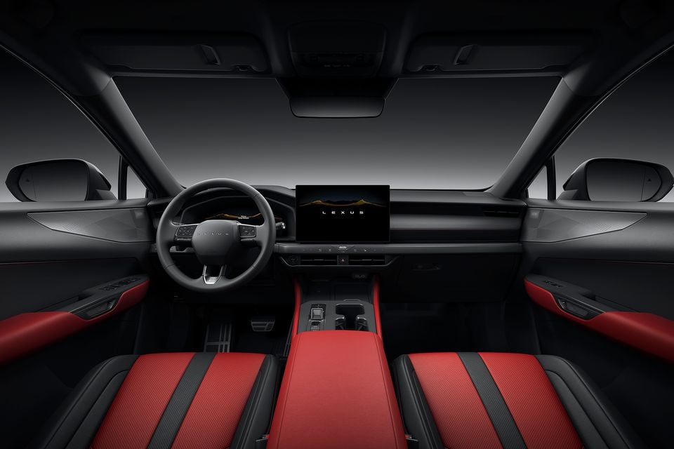 Interior of a 2027 Lexus NX facelift showing the dashboard, large central touchscreen displaying the Lexus logo, steering wheel, and bold red and black front seats