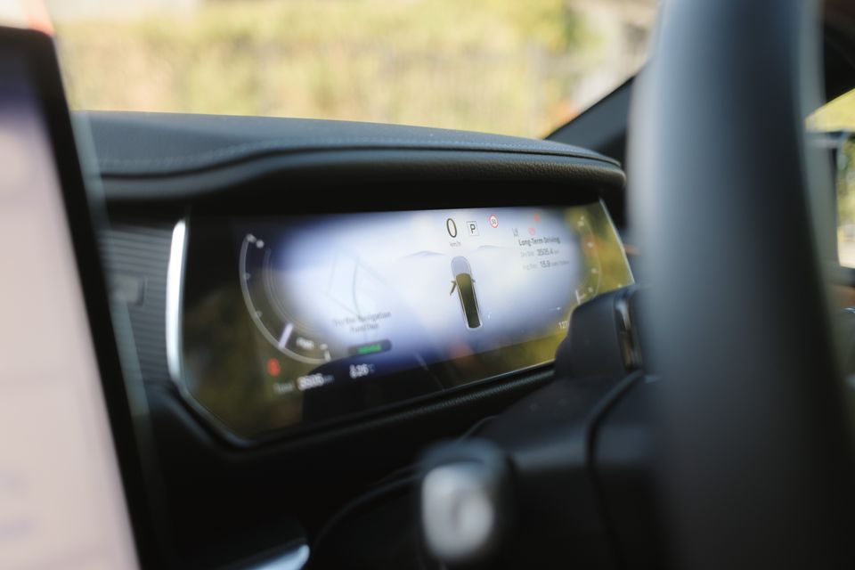 The digital instrument cluster of a 2027 Mazda 6e Atenza shows a speed of zero and a car icon while in park.