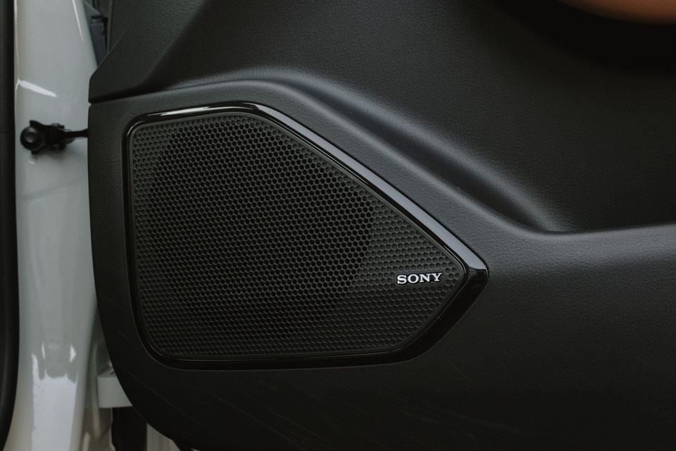 A close-up view of a Sony branded speaker built into the door panel of a 2027 Mazda 6e Atenza