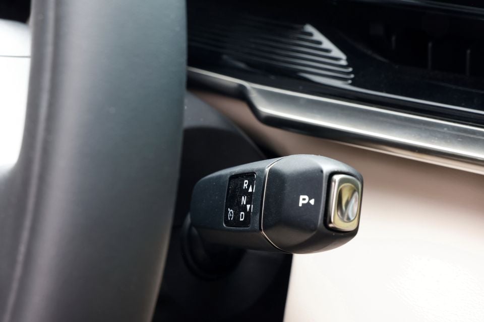 Close-up of the gear selector stalk on the steering column in a 2027 Mazda CX-6e, showing the park, reverse, neutral and drive settings