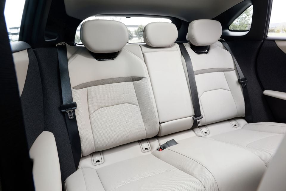 Rear seats with cream leather upholstery and headrests in a 2027 Mazda CX-6e SUV