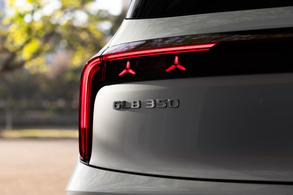 Close-up of the illuminated star-pattern tail-light and GLB 350 badge on the tailgate of a silver 2027 Mercedes-Benz GLB 350 4Matic electric SUV