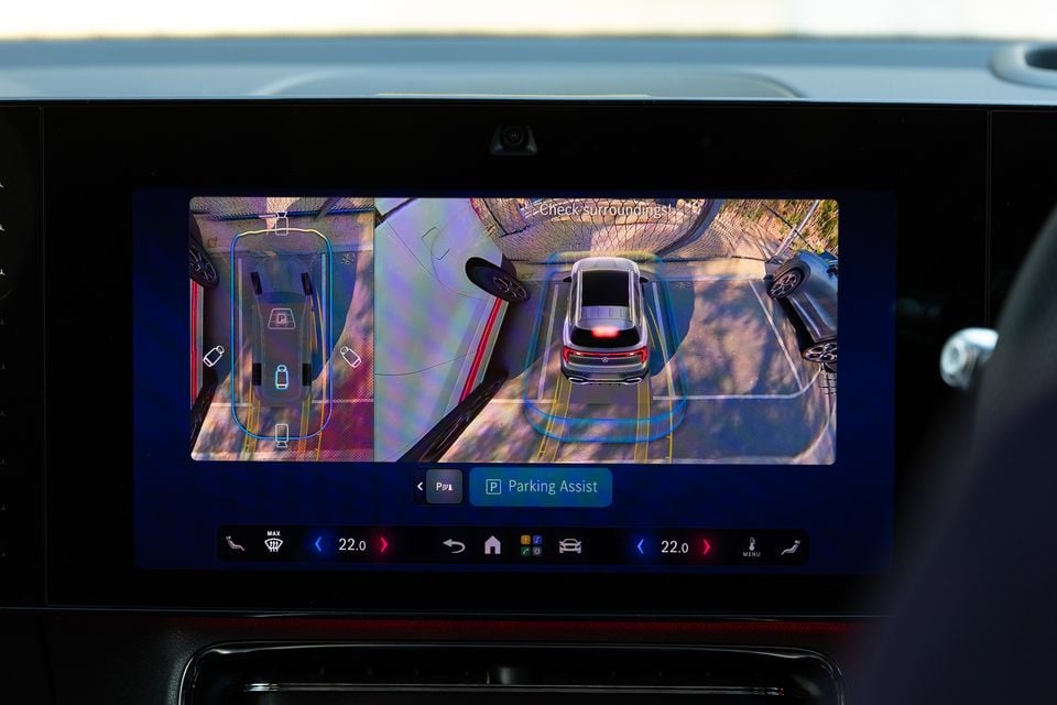 The 2027 Mercedes-Benz GLB 350 4Matic electric's central touchscreen showing Parking Assist with a 360-degree camera view of the car in a parking bay