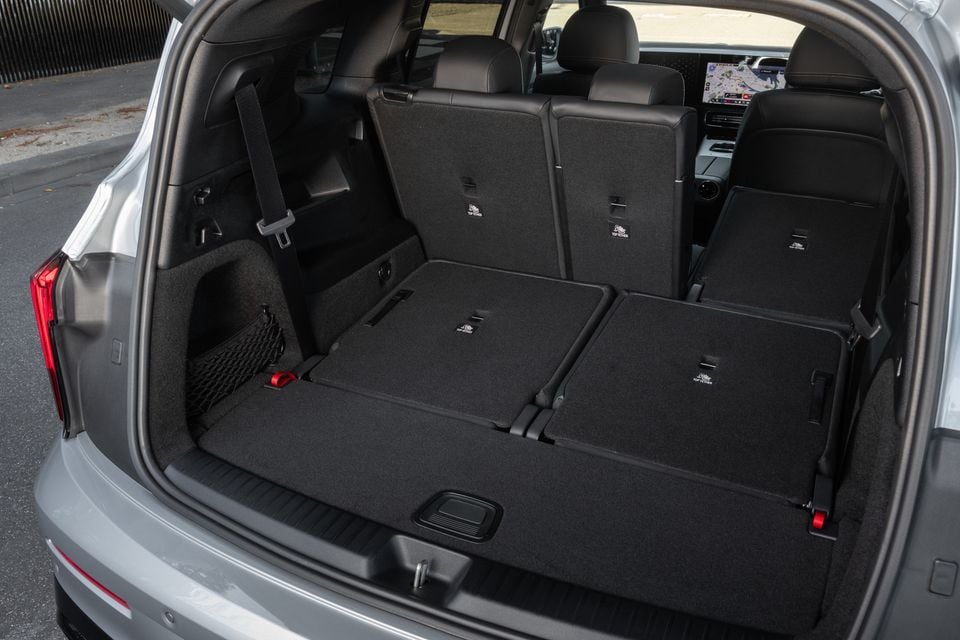 Boot of a silver 2027 Mercedes-Benz GLB 350 4Matic electric SUV with the third-row seats folded flat, viewed through the open tailgate