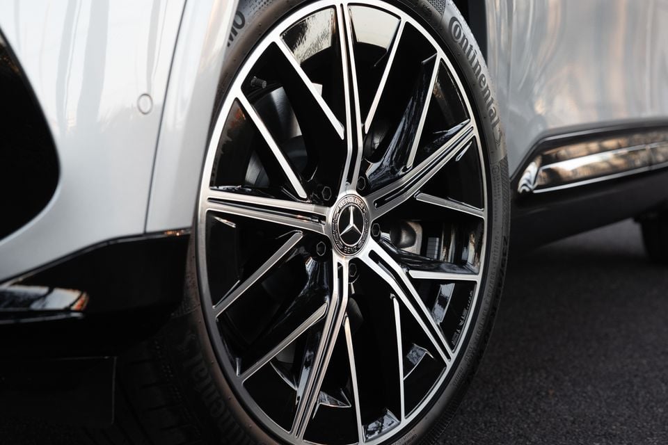 Close-up of the black and machined-silver multi-spoke alloy wheel on a silver 2027 Mercedes-Benz GLB 350 4Matic electric SUV