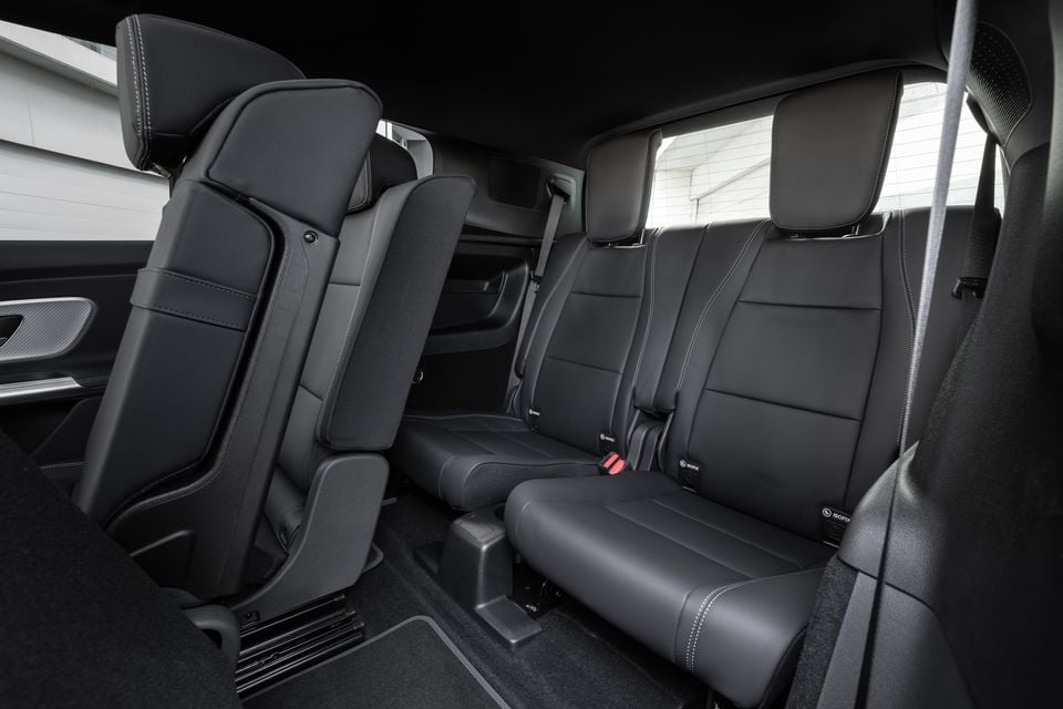 Black leather third-row seats with ISOFIX labels in the 2027 Mercedes-Benz GLB 350 4Matic electric SUV, with the second row folded forward