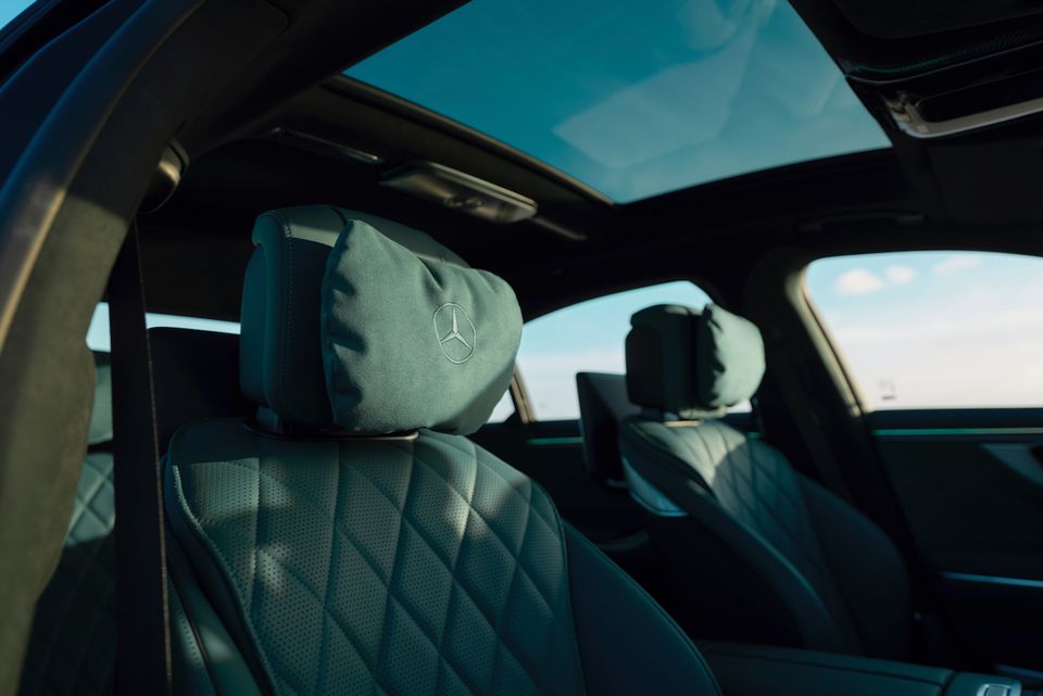 Diamond-quilted leather seats with Mercedes-Benz branded headrest covers inside a 2027 Mercedes-Benz S-Class, with a large sunroof overhead.