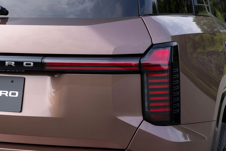 Close-up of the rear tail light and badge detail on a 2027 Mitsubishi Pajero, finished in a bronze-brown colour