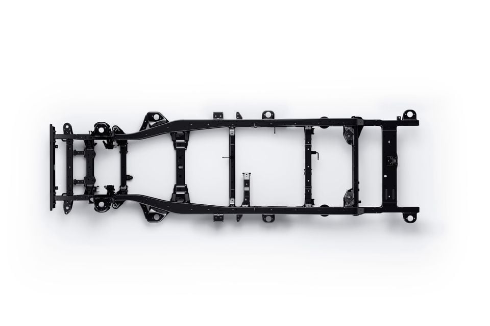 A ladder-frame chassis for a ute or 4WD, shown from above against a white background, likely for the 2027 Mitsubishi Pajero.