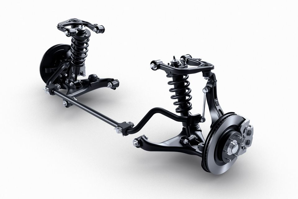 A double-wishbone front suspension assembly with coil-over shock absorbers, control arms, anti-roll bar and disc brakes, shown on a white background
