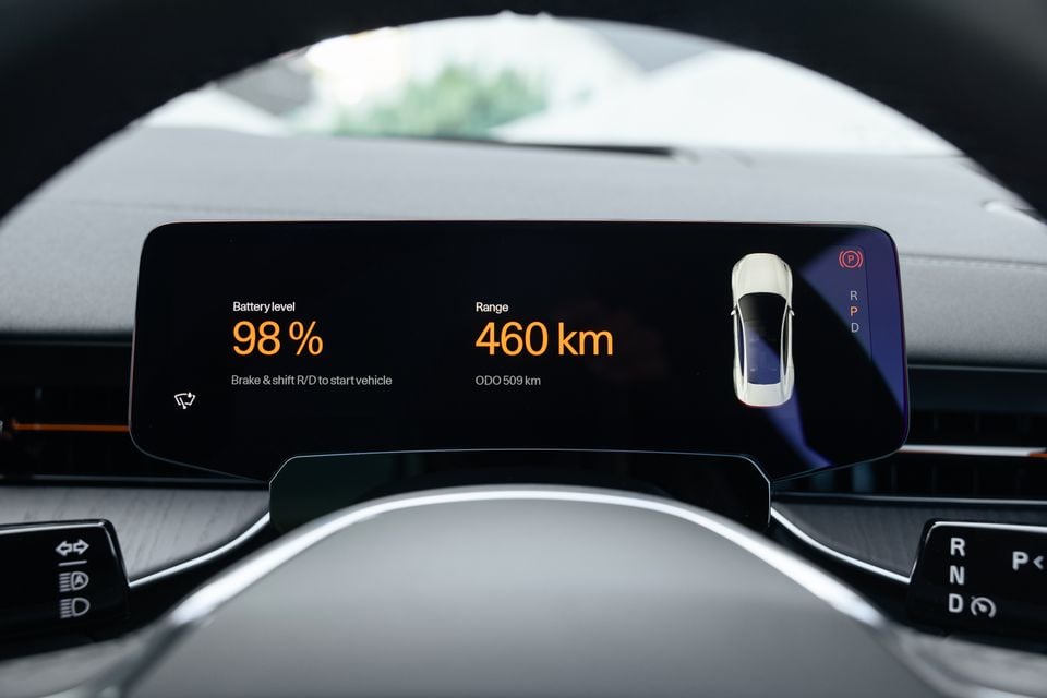 Digital instrument display in the 2027 Polestar 5 Performance seen through the steering wheel, showing 98% battery level and 460km range