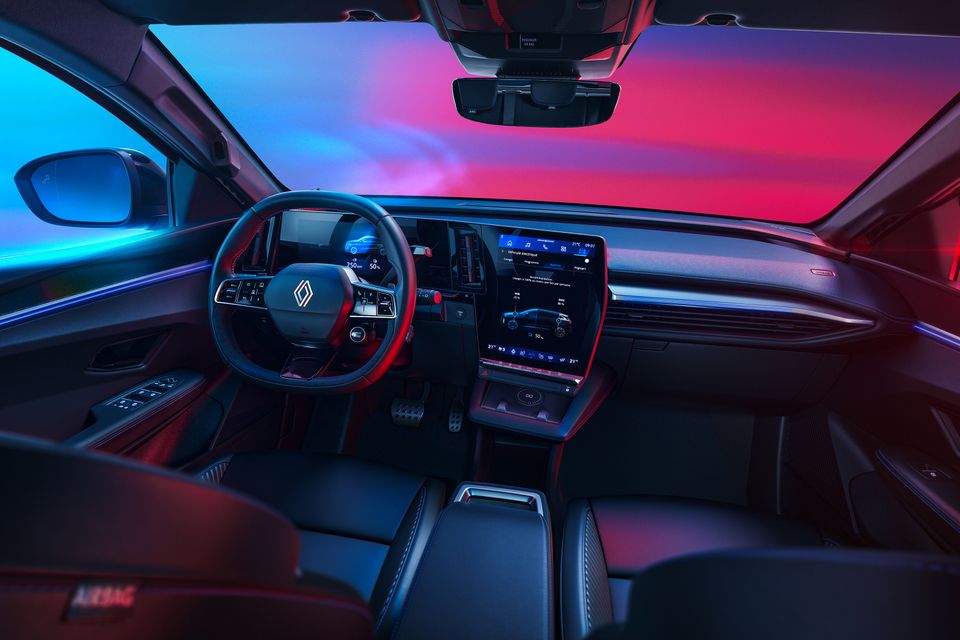 Dashboard of the Renault Megane E-Tech Esprit Alpine, with a steering wheel, digital driver display, portrait touchscreen and leather front seats