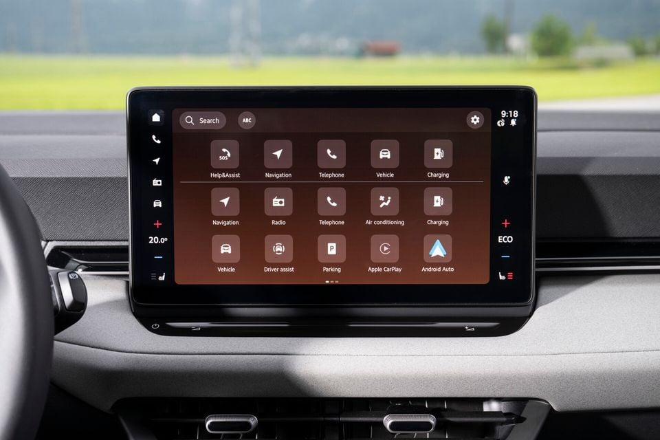 The touchscreen infotainment system of a Skoda Epiq showing the main menu with options including Navigation, Telephone, Vehicle, Charging, Air conditioning, Driver assist, Parking, Apple CarPlay, and Android Auto