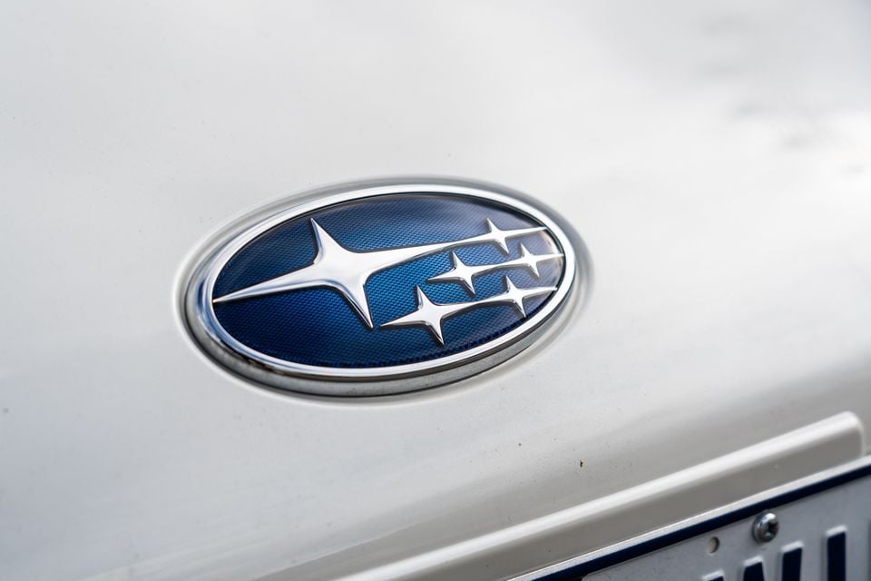 Close-up of the Subaru logo badge on the rear of a white Subaru BRZ