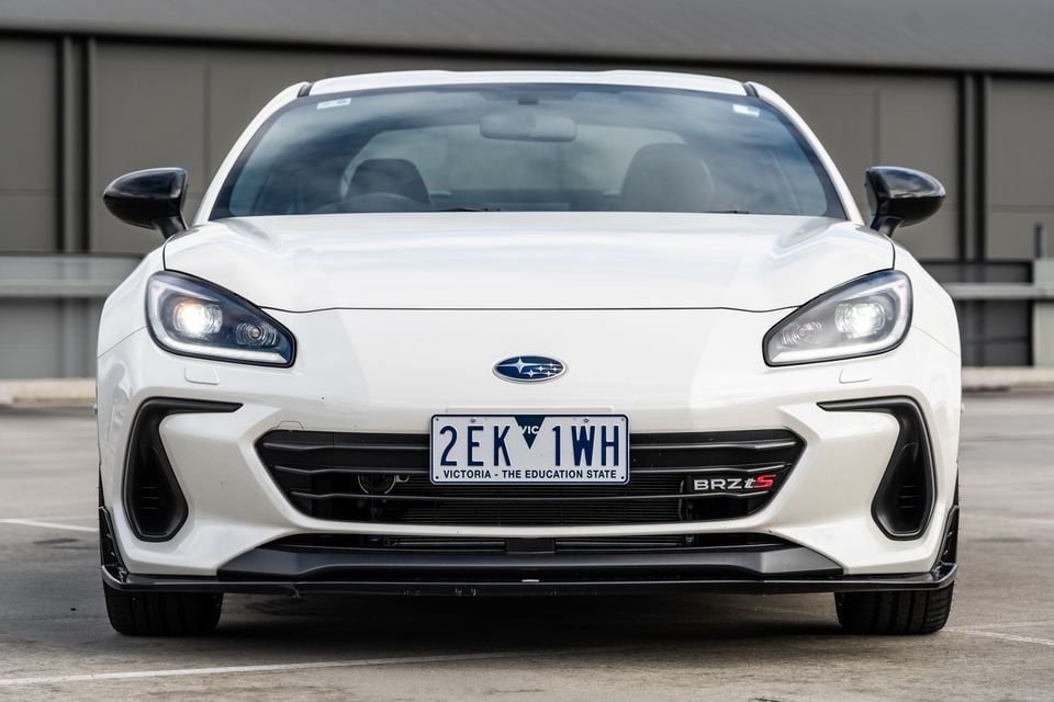White Subaru BRZ tS coupe seen from the front, parked in a car park with a Victorian number plate