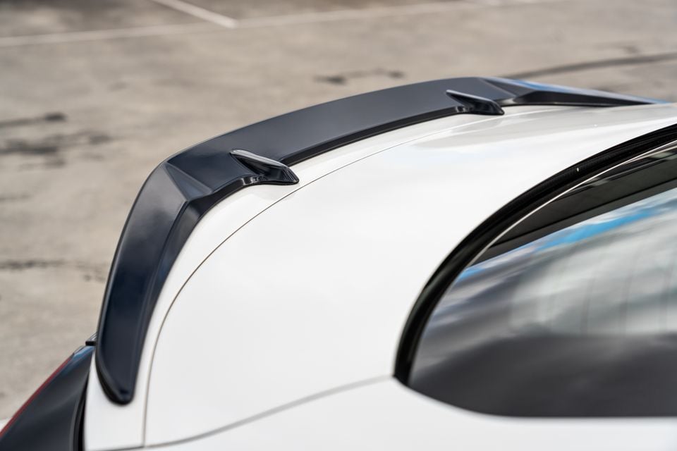 Close-up of the black roof spoiler on a white Subaru BRZ tS, viewed from above and slightly behind