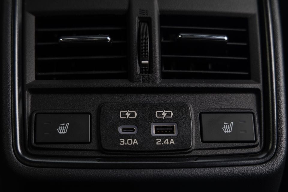 Rear centre console of a Subaru Outback Wilderness showing dual USB charging ports (USB-C 3.0A and USB-A 2.4A), heated seat buttons, and rear air vents