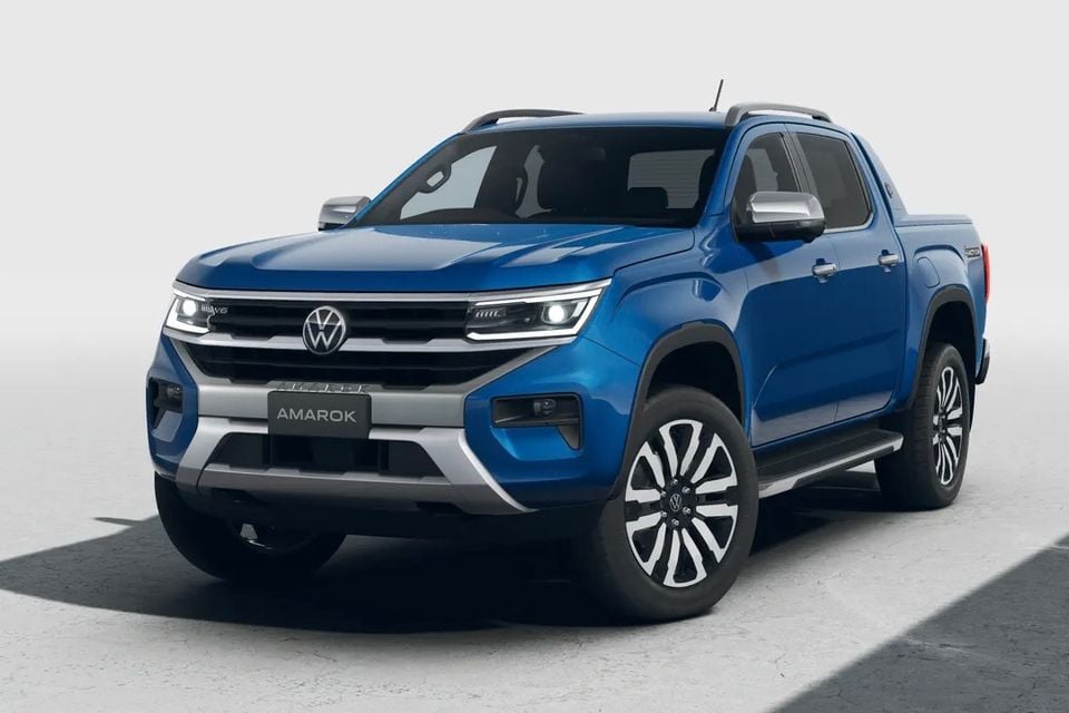 A blue Volkswagen Amarok dual-cab ute seen from the front three-quarter angle against a neutral studio background