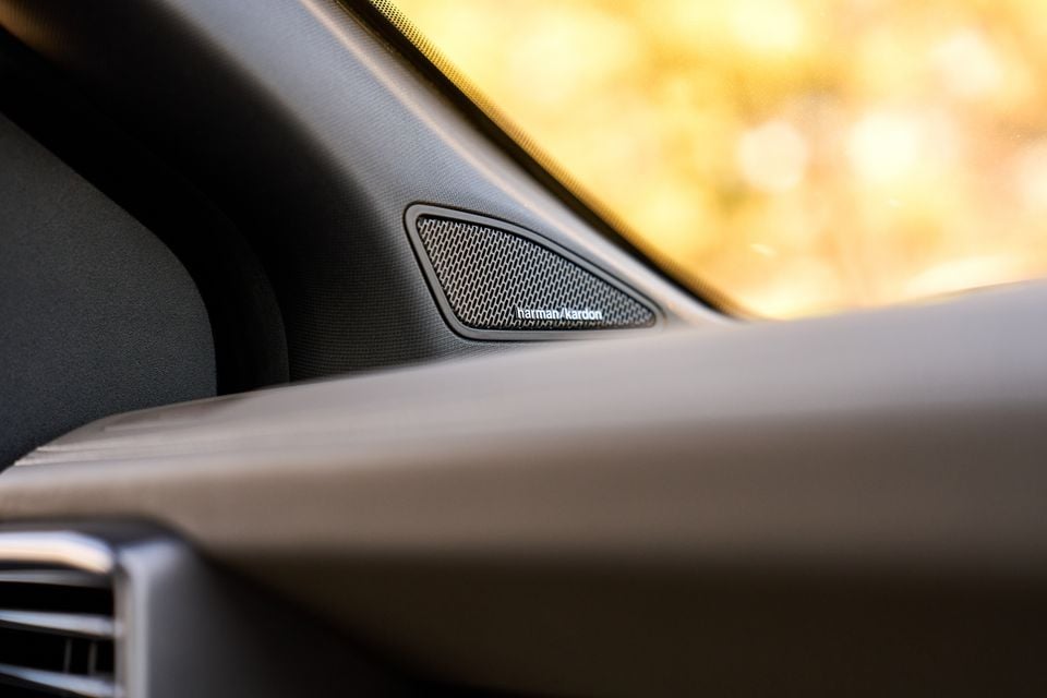 A Harman Kardon speaker mounted on the dashboard corner of a Volkswagen Amarok W600 Walkinshaw interior