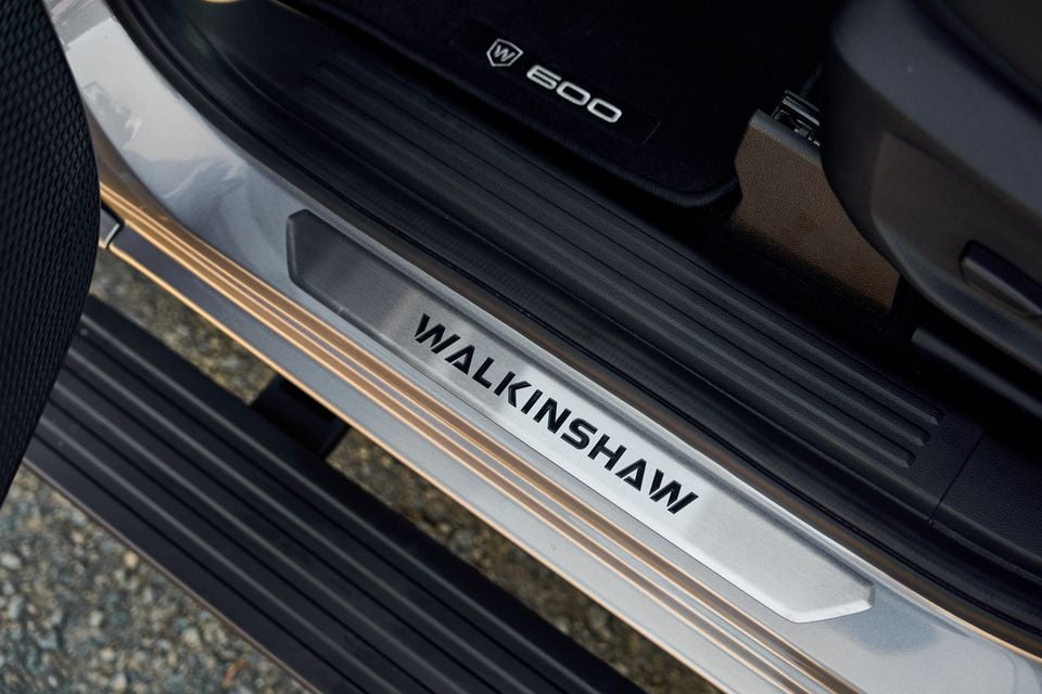 Walkinshaw-branded door sill plate on a Volkswagen Amarok W600, with the W600 logo visible on the floor mat inside the cabin.